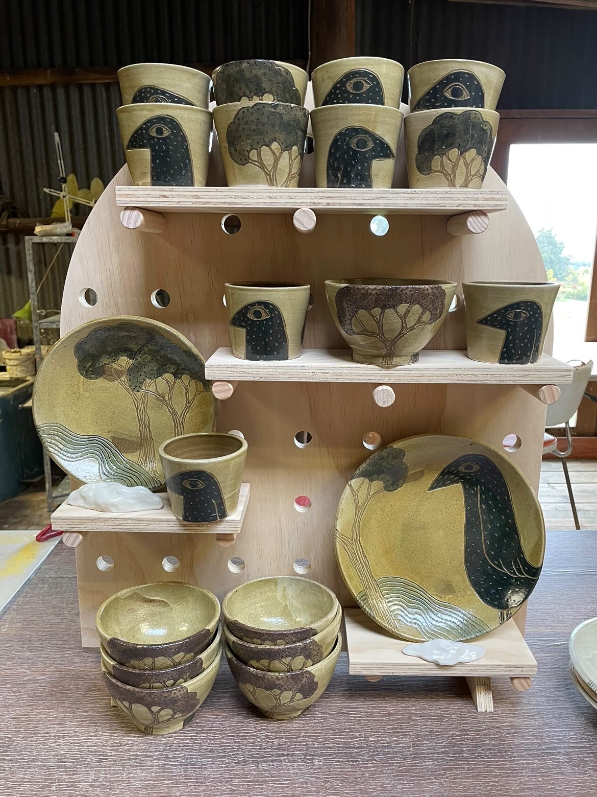 Arch shaped pegboard set displaying Mountain Clay Ceramics